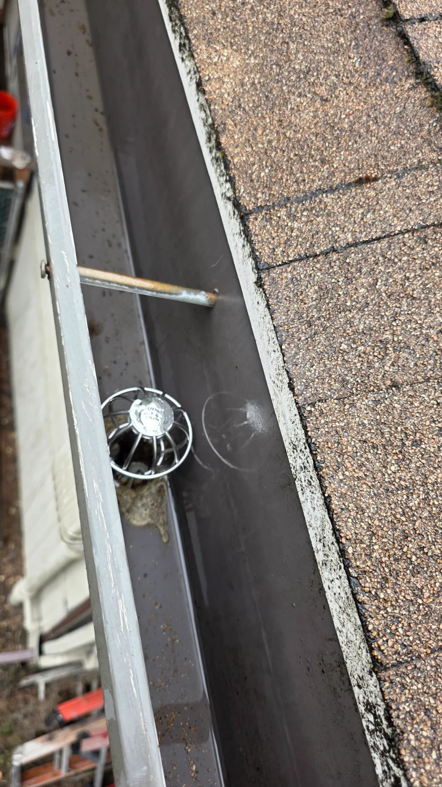 A clean gutter and downspout strainer after JNR Industries gutter service in Portland
