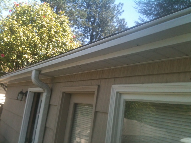 Downspout and gutter corner checked below the eave during the same visit